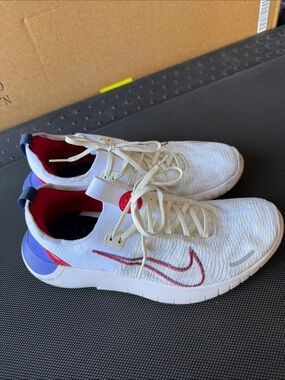 Nike White Knit Free Runs with Red & Blue Accents